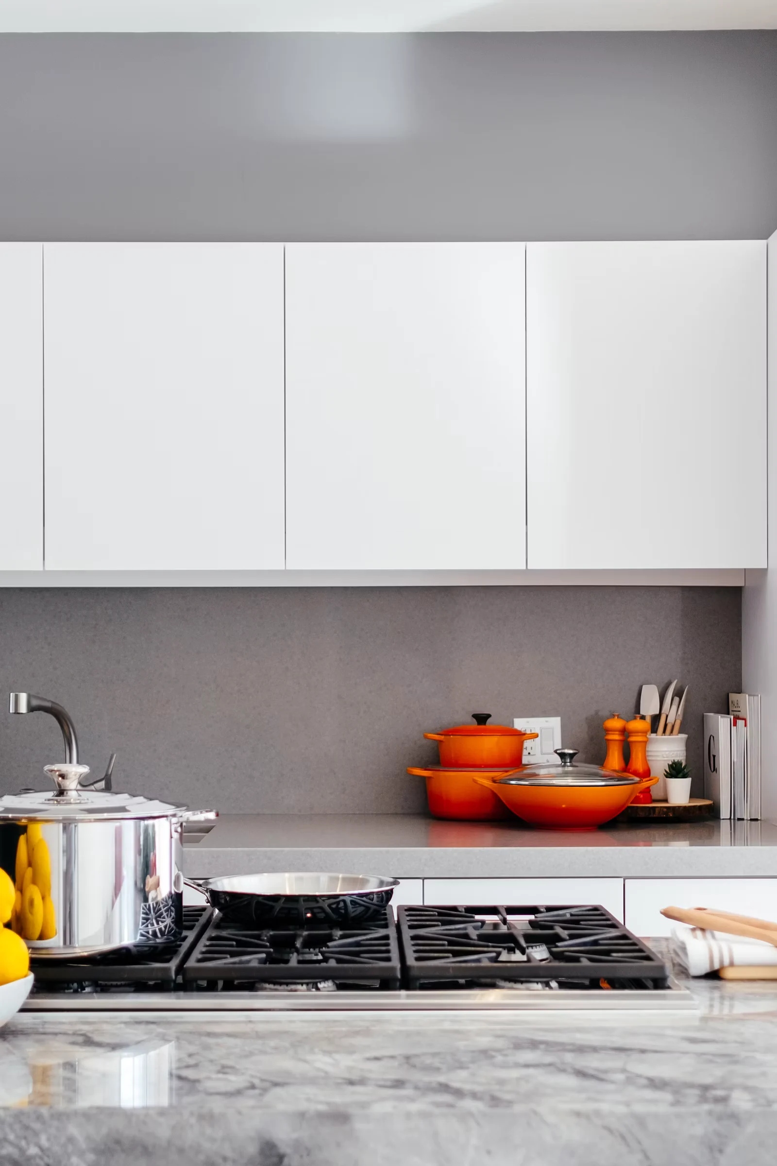 Vertical view of a kitchen with wood cabinets